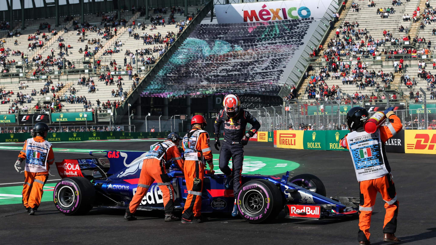Marshals recover the car of Pierre Gasly (FRA) Scuderia Toro Rosso STR12 after stopping on track in