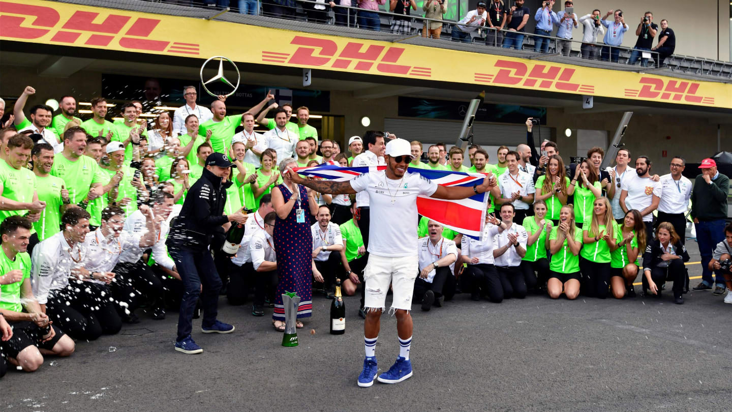 World Champion Lewis Hamilton (GBR) Mercedes AMG F1 celebrates with the team and the champagne at