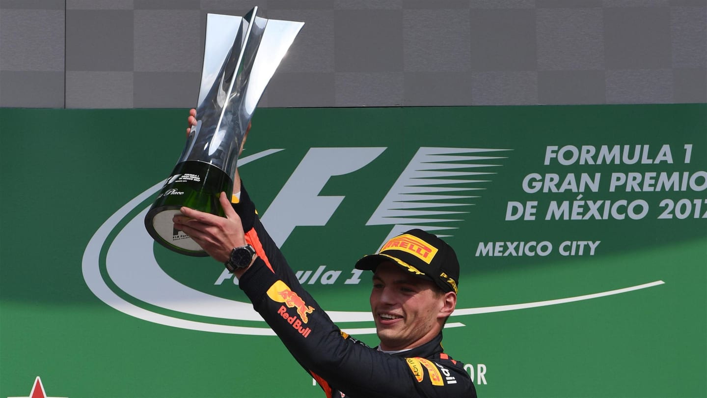 Race winner Max Verstappen (NED) Red Bull Racing celebrates on the podium with the trophy at