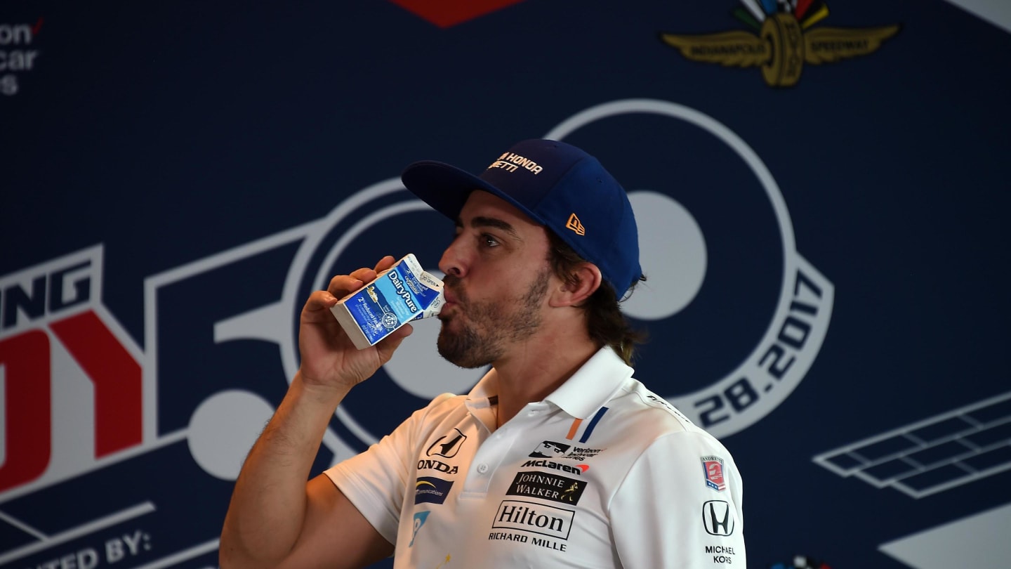 Race retiree Fernando Alonso (ESP) McLaren Honda Andretti Autosport drinks the milk at Indianapolis