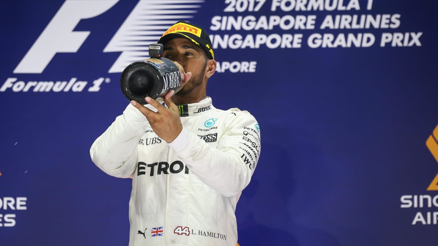 Race winner Lewis Hamilton (GBR) Mercedes AMG F1 Celebrates on the podium with the champagne at