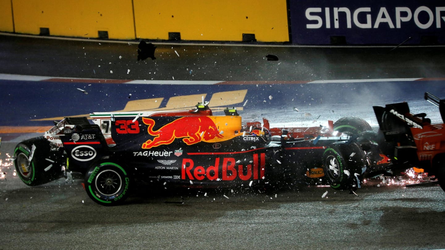 The cars of Kimi Raikkonen (FIN) Ferrari SF70-H and Max Verstappen (NED) Red Bull Racing RB13 crash and collide at Formula One World Championship, Rd14, Singapore Grand Prix, Race, Marina Bay Street Circuit, Singapore, Sunday 17 September 2017. © Manuel Goria/Sutton Images