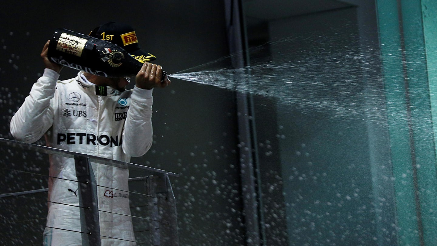 Race winner Lewis Hamilton (GBR) Mercedes AMG F1 celebrates on the podium with the champagne at Formula One World Championship, Rd14, Singapore Grand Prix, Race, Marina Bay Street Circuit, Singapore, Sunday 17 September 2017. © Kym Illman/Sutton Images