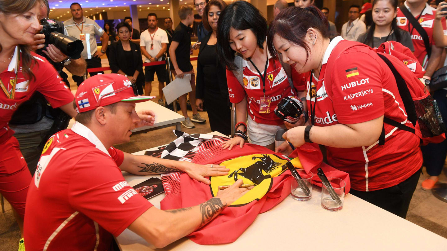 Kimi Raikkonen (FIN) Ferrari signs autographs for the fans at Formula One World Championship, Rd14, Singapore Grand Prix, Preparations, Marina Bay Street Circuit, Singapore, Thursday 14 September 2017. © Sutton Images