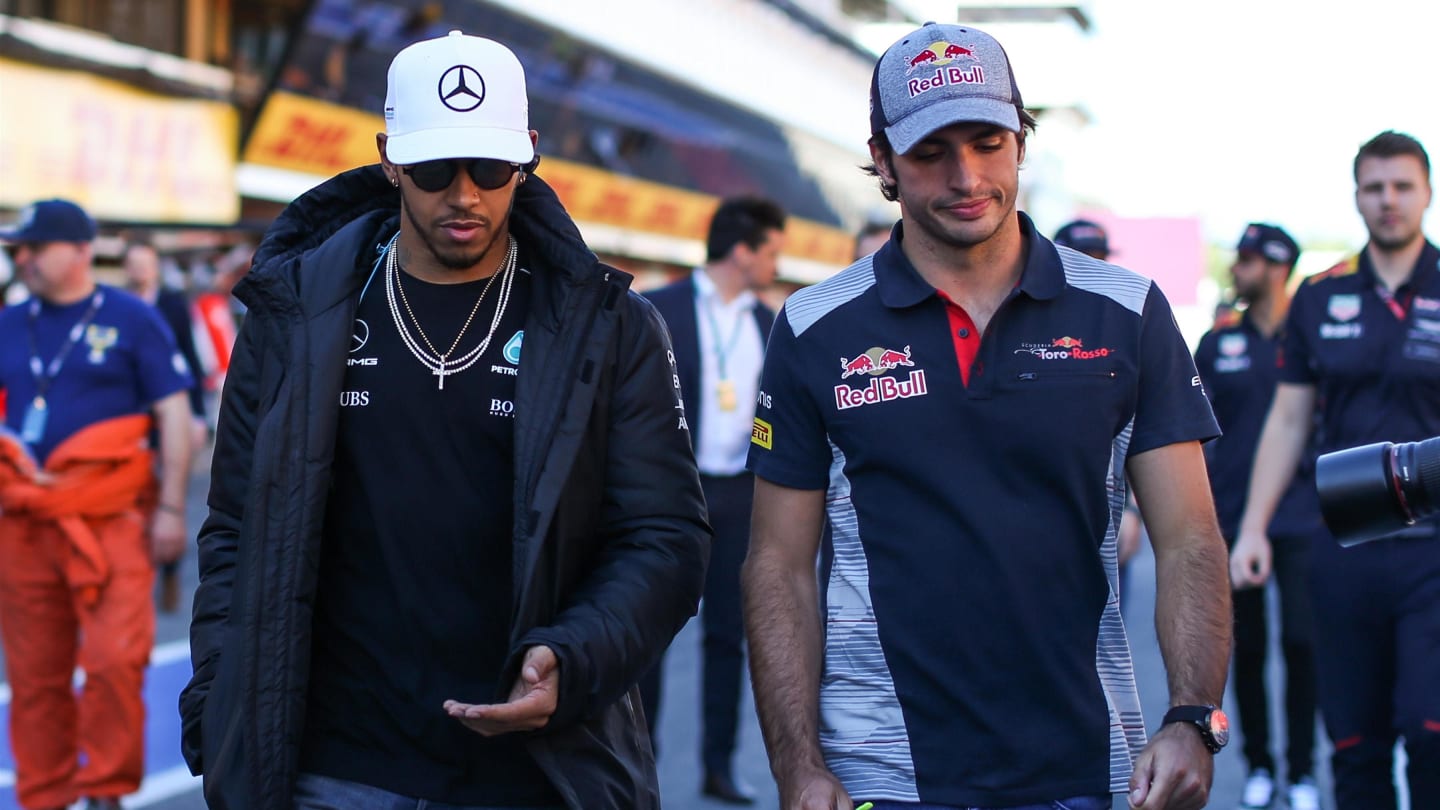 Lewis Hamilton (GBR) Mercedes AMG F1 and Carlos Sainz jr (ESP) Scuderia Toro Rosso at Formula One