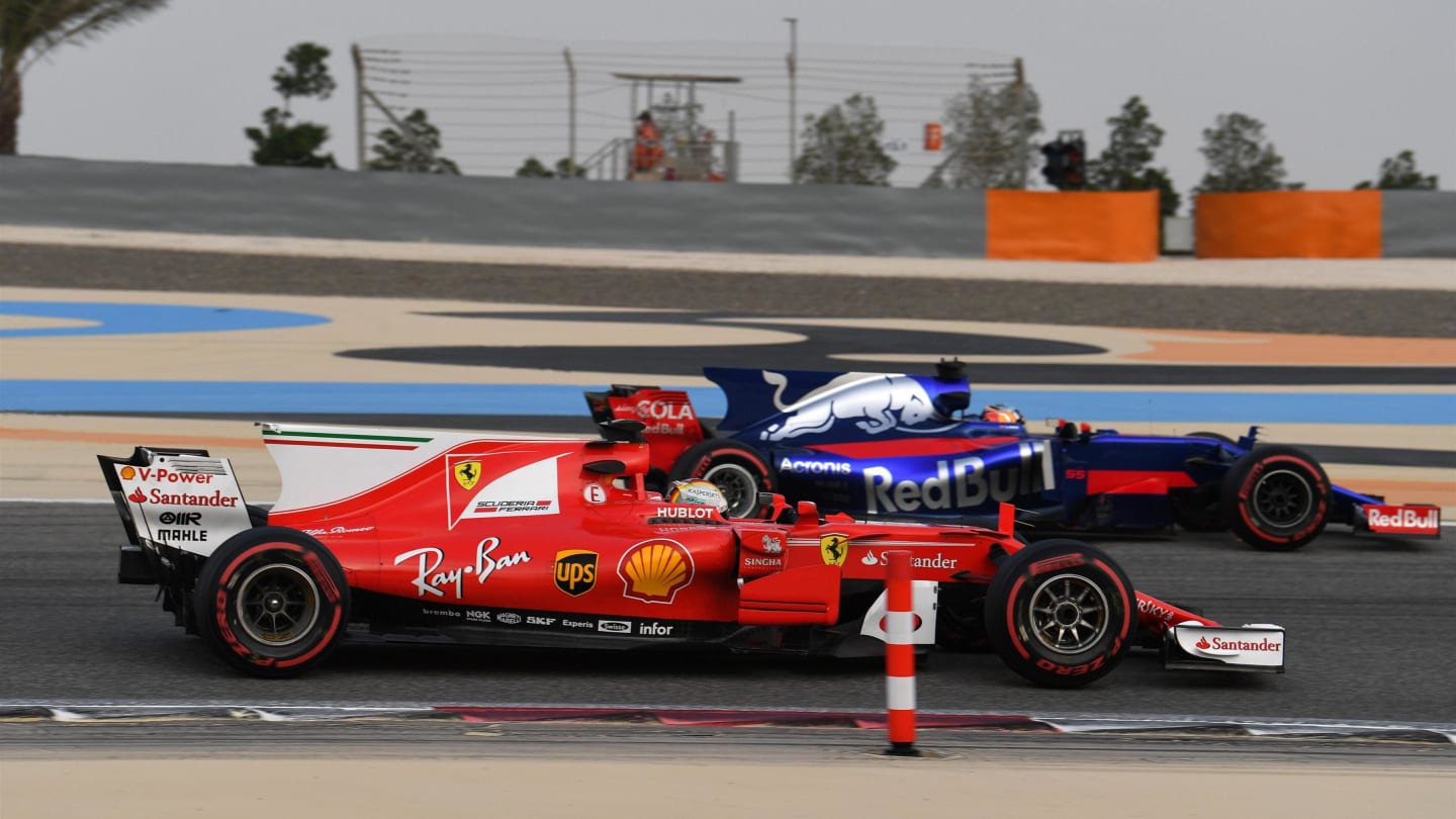 Sebastian Vettel (GER) Ferrari SF70-H and Carlos Sainz jr (ESP) Scuderia Toro Rosso STR12 at Formula One Testing, Day Two, Bahrain International Circuit, Sakhir, Bahrain, Wednesday 19 April 2017. © Sutton Motorsport Images