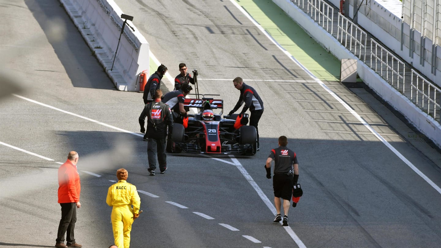 Kevin Magnussen (DEN) Haas VF-17 is pushed by mechanics in pit lane at Formula One Testing, Day One, Barcelona, Spain, 27 February 2017. © Sutton Images