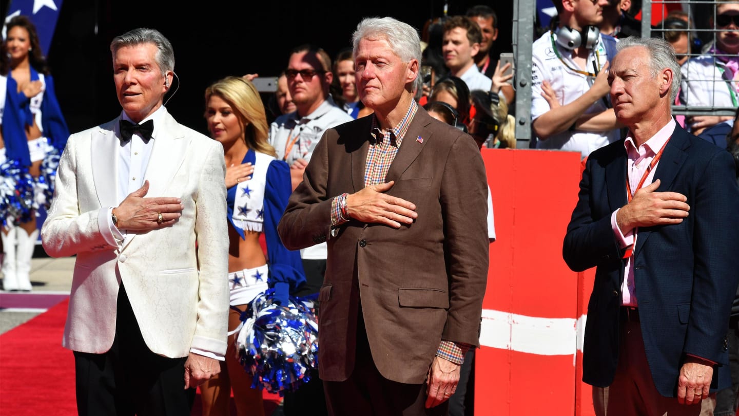 Micahel Buffer (USA) and Bill Clinton (USA) on the grid at Formula One World Championship, Rd17,