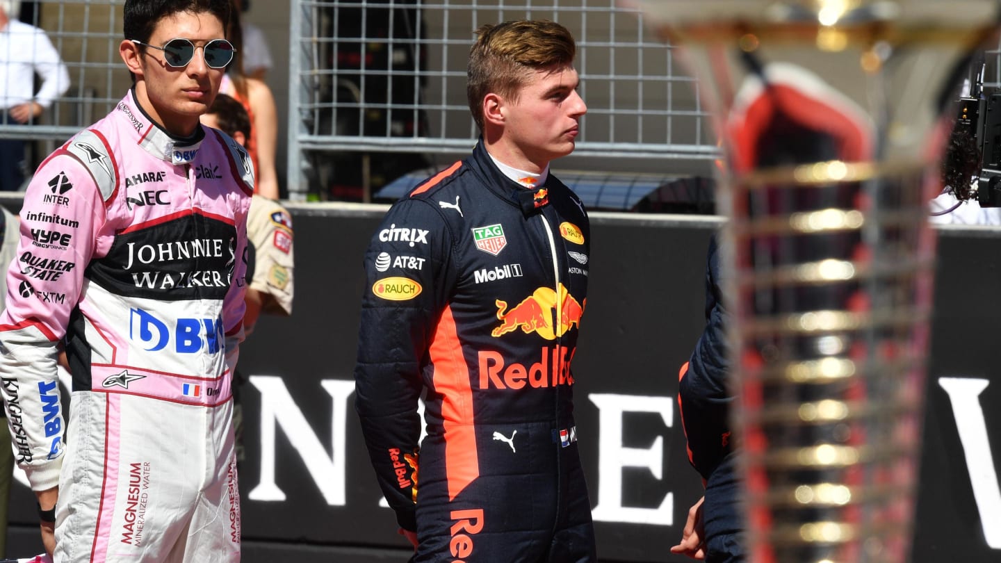 Esteban Ocon (FRA) Force India F1 and Max Verstappen (NED) Red Bull Racing on the grid at Formula