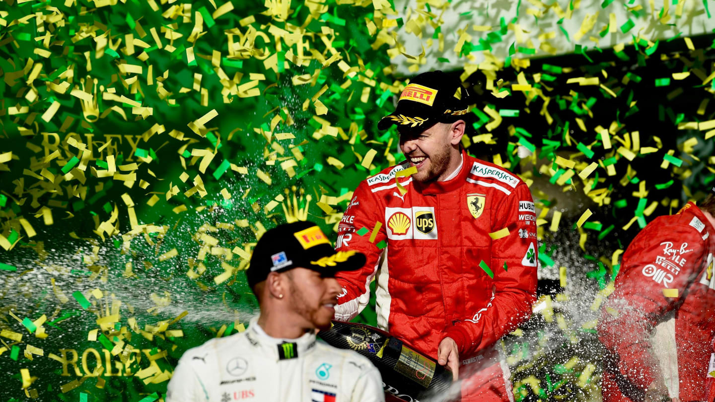Lewis Hamilton (GBR) Mercedes-AMG F1 and Sebastian Vettel (GER) Ferrari celebrate on the podium with the champagne at Formula One World Championship, Rd1, Australian Grand Prix, Race, Melbourne, Australia, Sunday 25 March 2018. © Jery Andre/Sutton Images