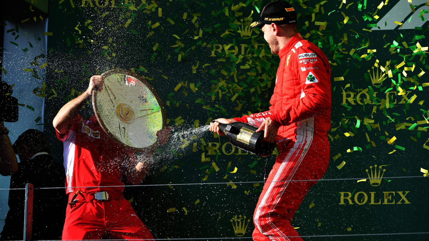 Race winner Sebastian Vettel (GER) Ferrari celebrates with the champagne on the podium at Formula