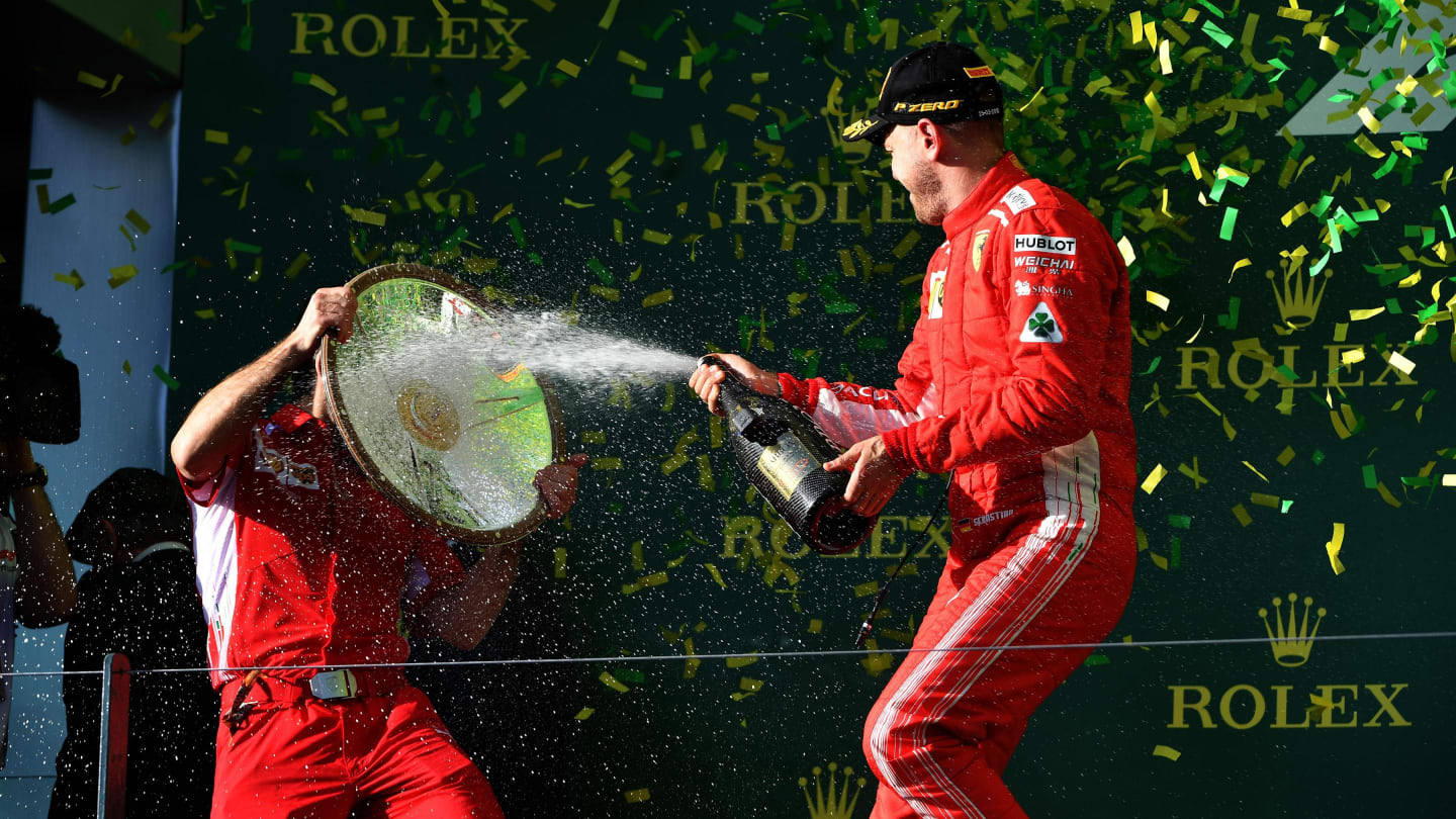 Race winner Sebastian Vettel (GER) Ferrari celebrates with the champagne on the podium at Formula One World Championship, Rd1, Australian Grand Prix, Race, Melbourne, Australia, Sunday 25 March 2018. © Mark Sutton/Sutton Images