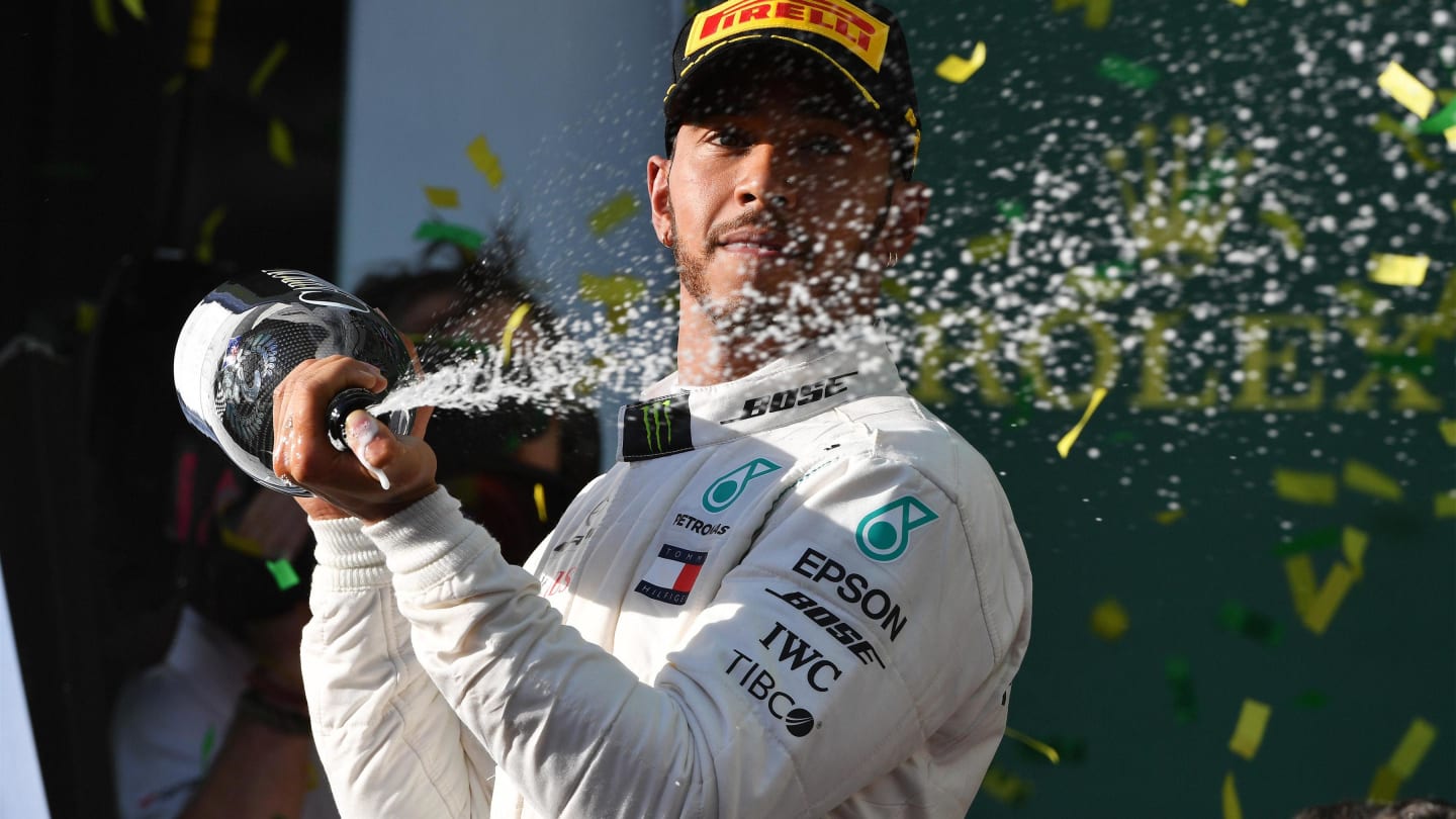 Lewis Hamilton (GBR) Mercedes-AMG F1 celebrates on the podium with the champagne at Formula One World Championship, Rd1, Australian Grand Prix, Race, Melbourne, Australia, Sunday 25 March 2018. © Mark Sutton/Sutton Images
