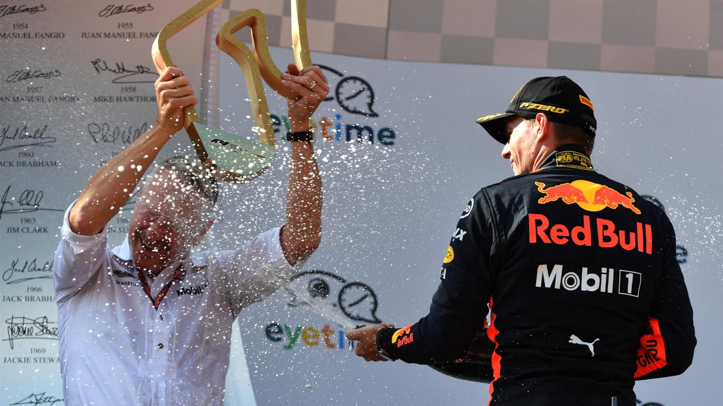 Race winner Max Verstappen (NED) Red Bull Racing celebrates on the podium with Jonathan Wheatley (GBR) Red Bull Racing Team Manager and the champagne at Formula One World Championship, Rd9, Austrian Grand Prix, Race, Spielberg, Austria, Sunday 1 July 2018