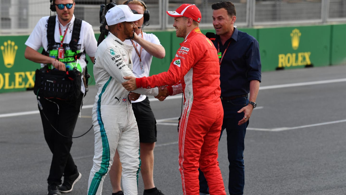 Pole sitter Sebastian Vettel (GER) Ferrari and Lewis Hamilton (GBR) Mercedes-AMG F1 celebrate in