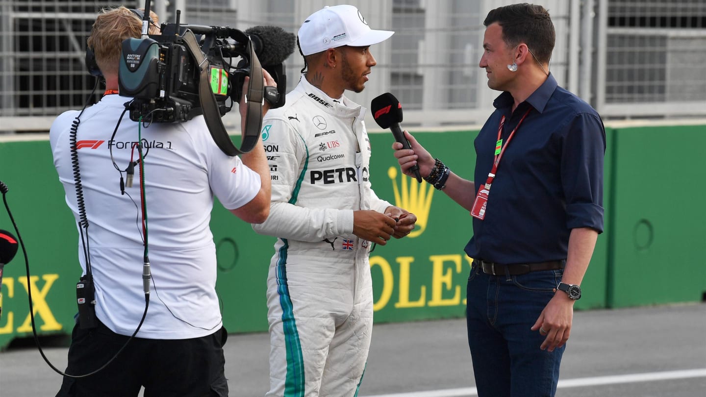 Lewis Hamilton (GBR) Mercedes-AMG F1 talks with Will Buxton (GBR) FOM TV Presenter in parc ferme at