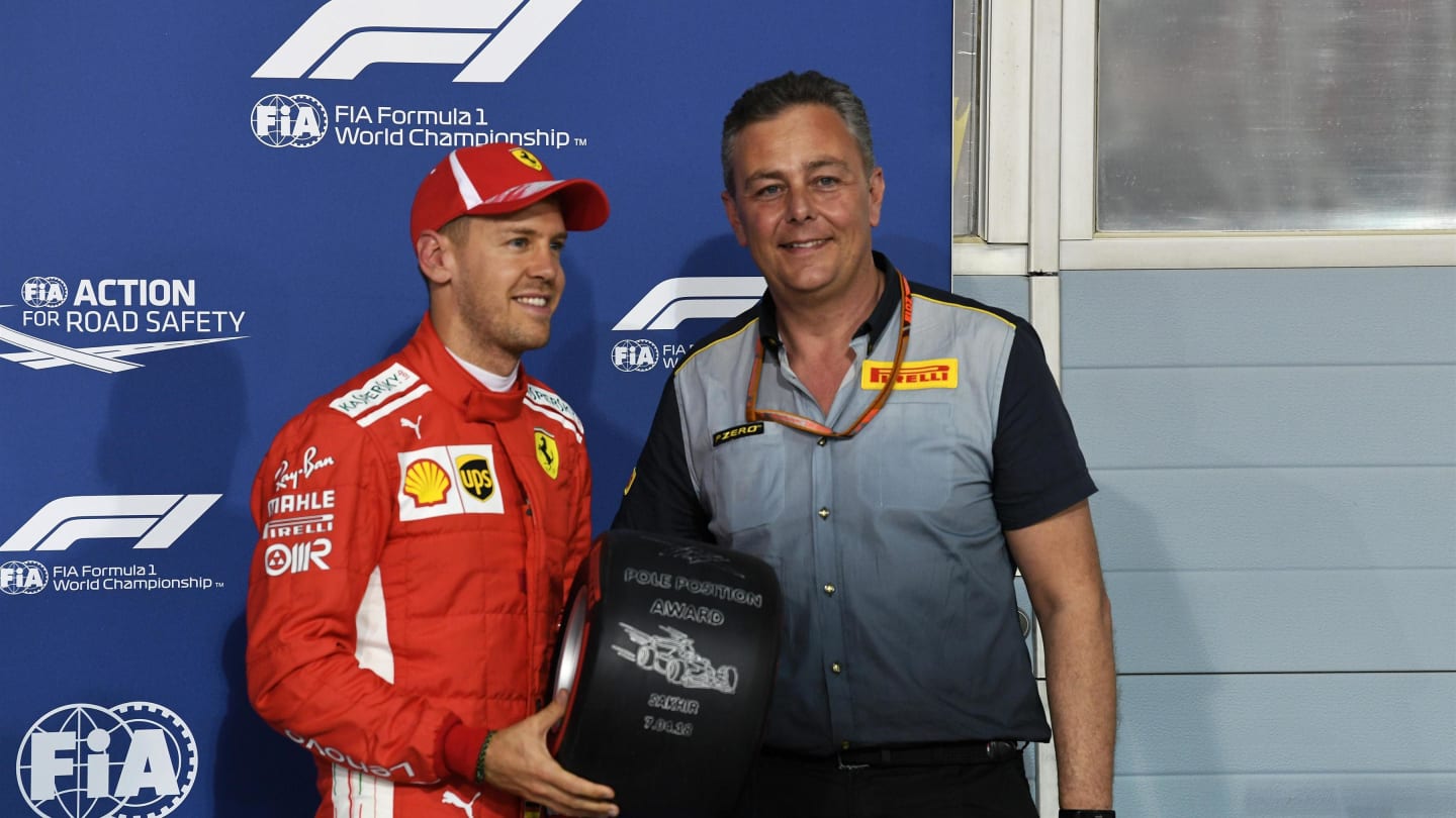 Sebastian Vettel receives the Pirelli award from Mario Isola Pirelli Sporting Director at F1 World Championship, Rd2, Bahrain Grand Prix, Qualifying, Bahrain International Circuit, Sakhir, Bahrain, Saturday 7 April 2018. © Mark Sutton/Sutton Images
