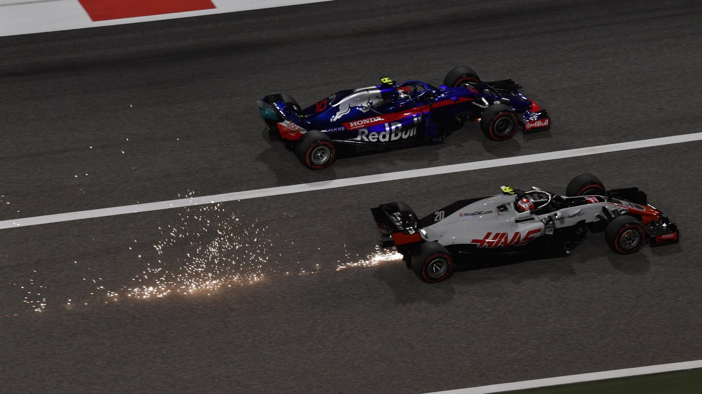 Kevin Magnussen (DEN) Haas VF-18 and Pierre Gasly (FRA) Scuderia Toro Rosso STR13 and sparks at Formula One World Championship, Rd2, Bahrain Grand Prix, Race, Bahrain International Circuit, Sakhir, Bahrain, Sunday 8 April 2018. © Mark Sutton/Sutton Images