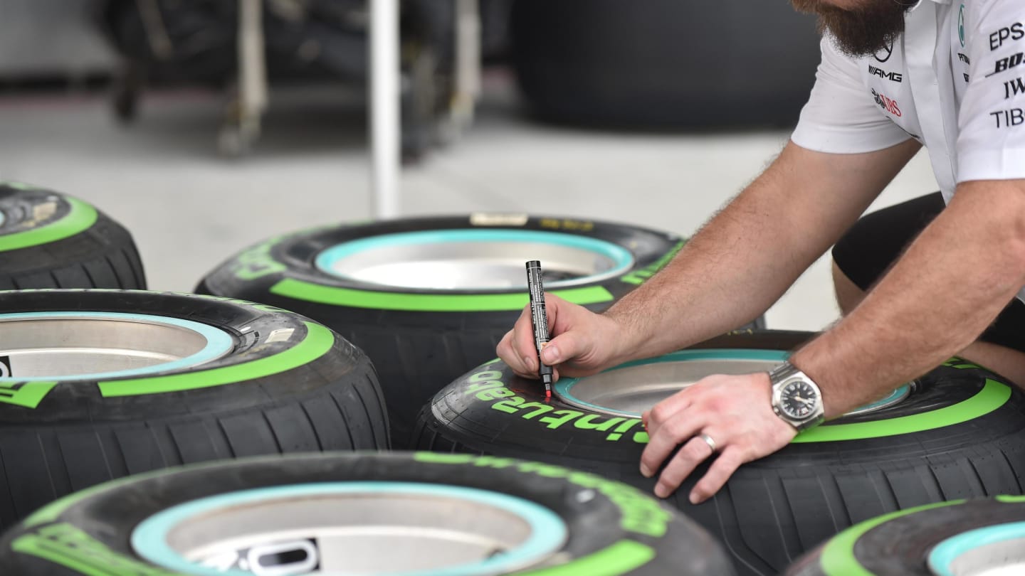 Mercedes AMG F1 mechanic marks Pirelli tyres at Formula One World Championship, Rd2, Bahrain Grand Prix, Preparations, Bahrain International Circuit, Sakhir, Bahrain, Thursday 5 April 2018. © Simon Galloway/Sutton Images
