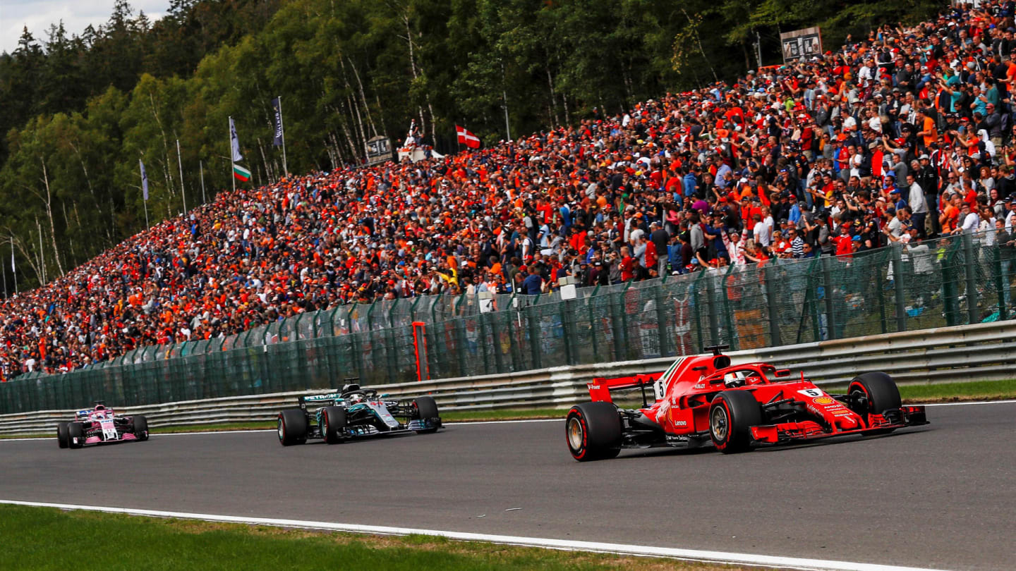 Sebastian Vettel, Ferrari SF71H leads Lewis Hamilton, Mercedes AMG F1 W09 and Sergio Perez, Racing