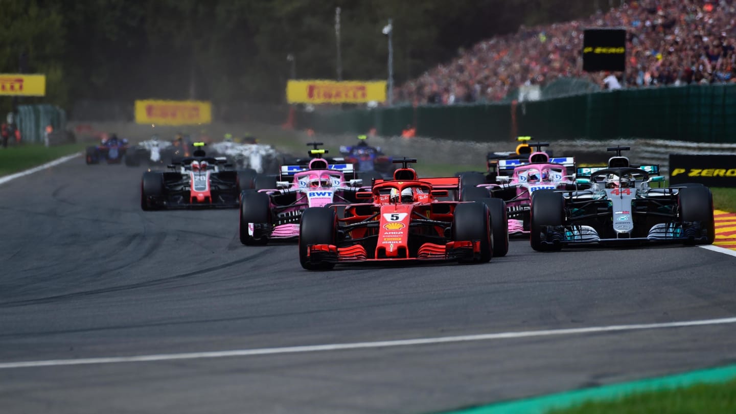 Sebastian Vettel, Ferrari SF71H leads Lewis Hamilton, Mercedes AMG F1 W09 and Esteban Ocon, Racing