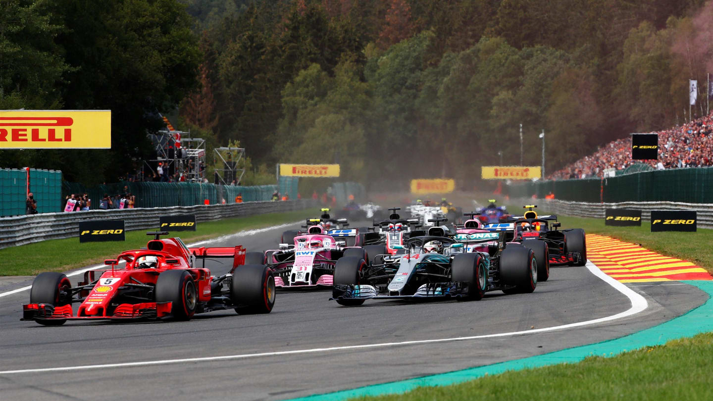 Sebastian Vettel, Ferrari SF71H and Lewis Hamilton, Mercedes AMG F1 W09 on lap one at Formula One