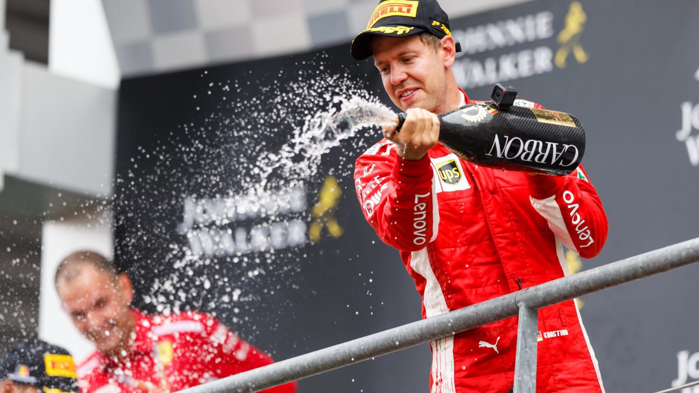 Sebastian Vettel, Ferrari celebrates with the champagne on the podium at Formula One World Championship, Rd13, Belgian Grand Prix, Race, Spa Francorchamps, Belgium, Sunday 26 August 2018. © Jerry Andre/Sutton Images