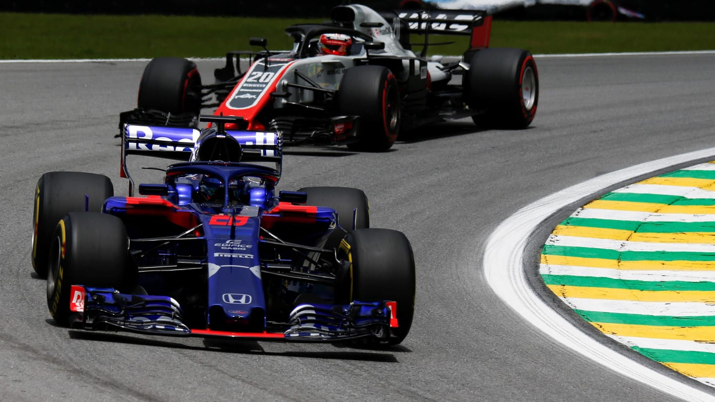 Brendon Hartley, Scuderia Toro Rosso STR13 and Kevin Magnussen, Haas F1 Team VF-18 at Formula One