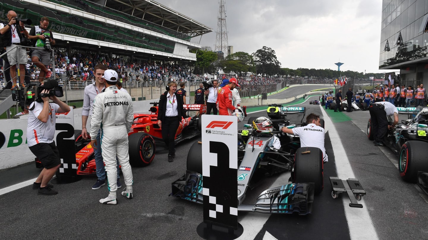 Pole sitter Lewis Hamilton, Mercedes AMG F1 talks with Paul di Resta, Sky TV in parc ferme at