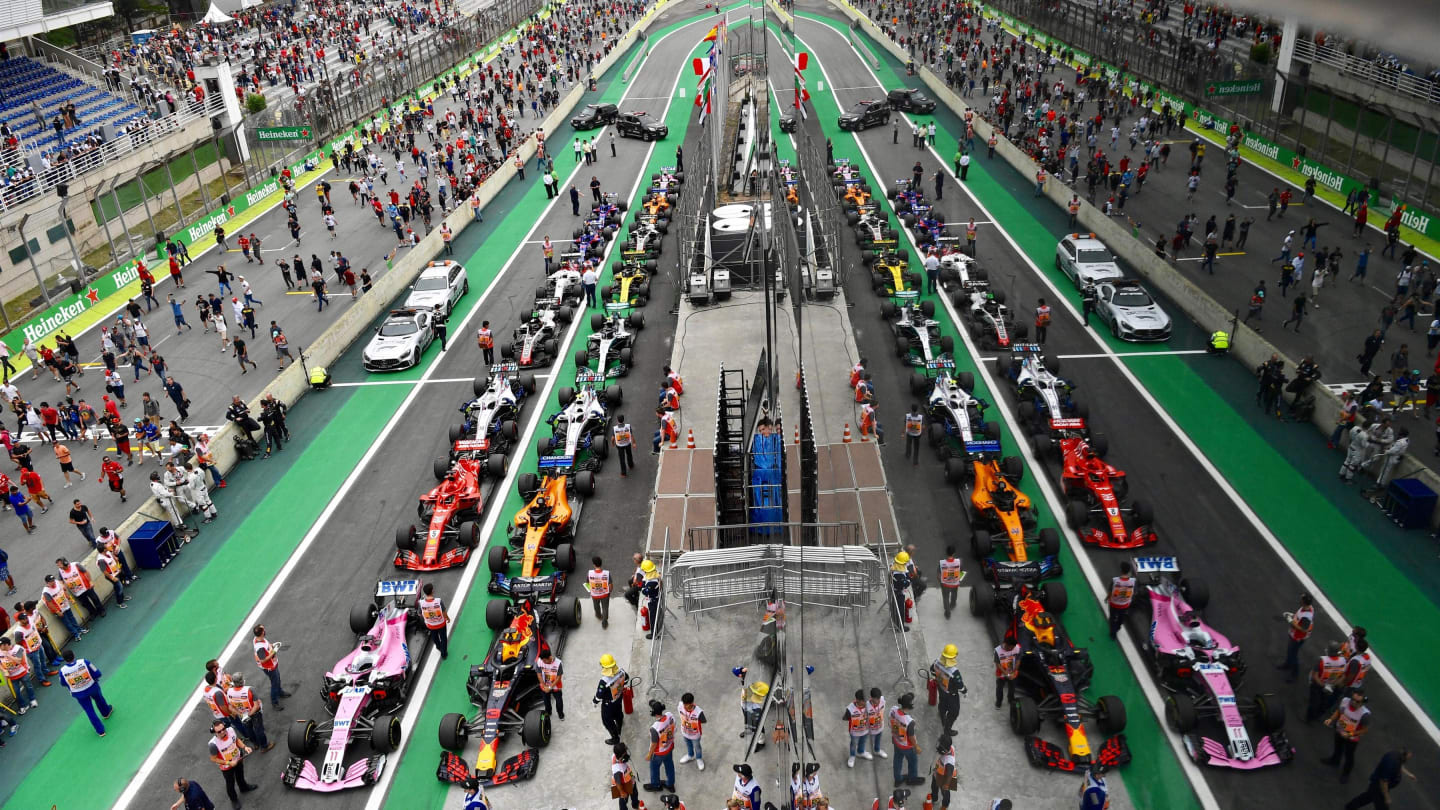 Fans invade the track towards Parc Ferme at Formula One World Championship, Rd20, Brazilian Grand