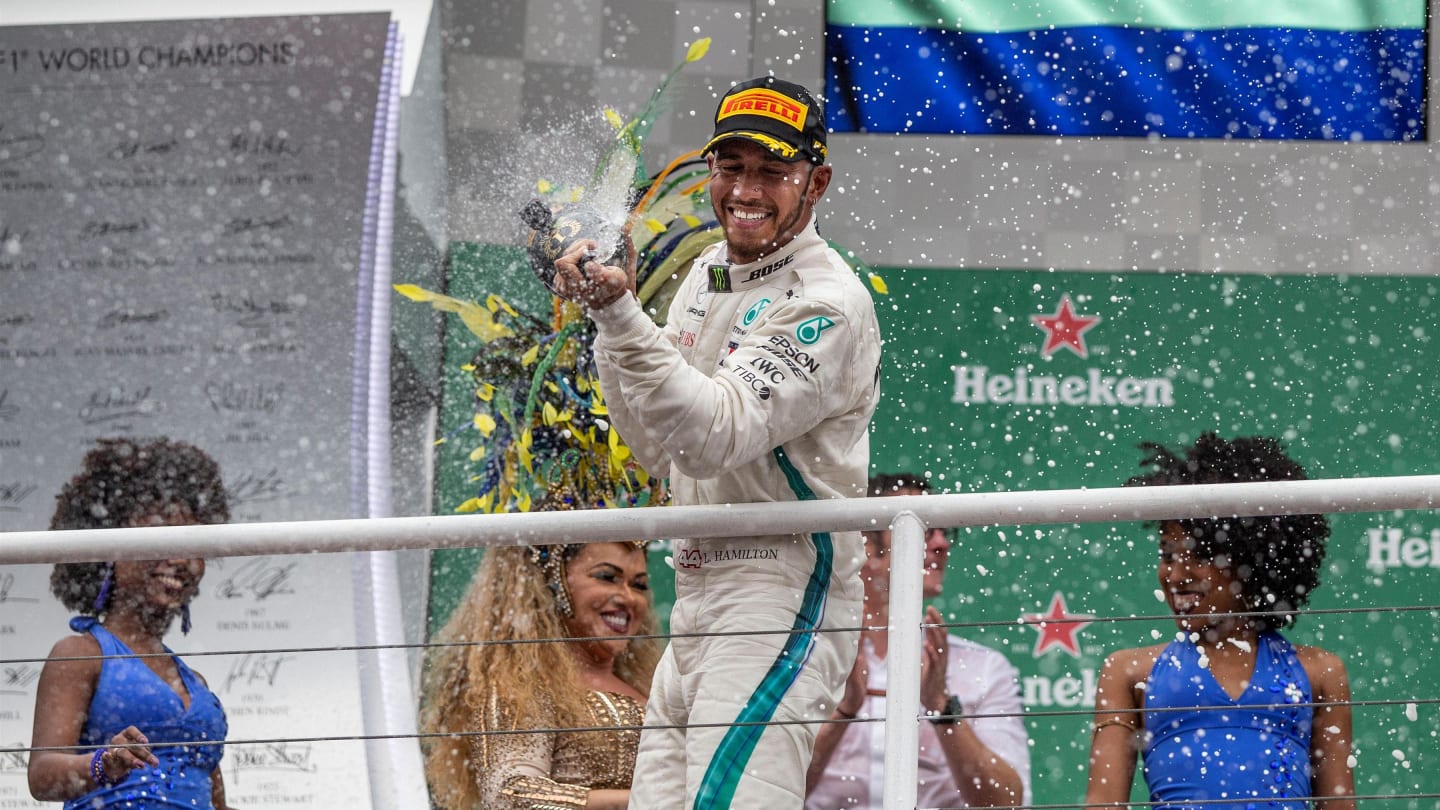 Race winner Lewis Hamilton, Mercedes AMG F1 celebrates on the podium with the champagne at Formula One World Championship, Rd20, Brazilian Grand Prix, Race, Interlagos, Sao Paulo, Brazil, Sunday 11 November 2018.