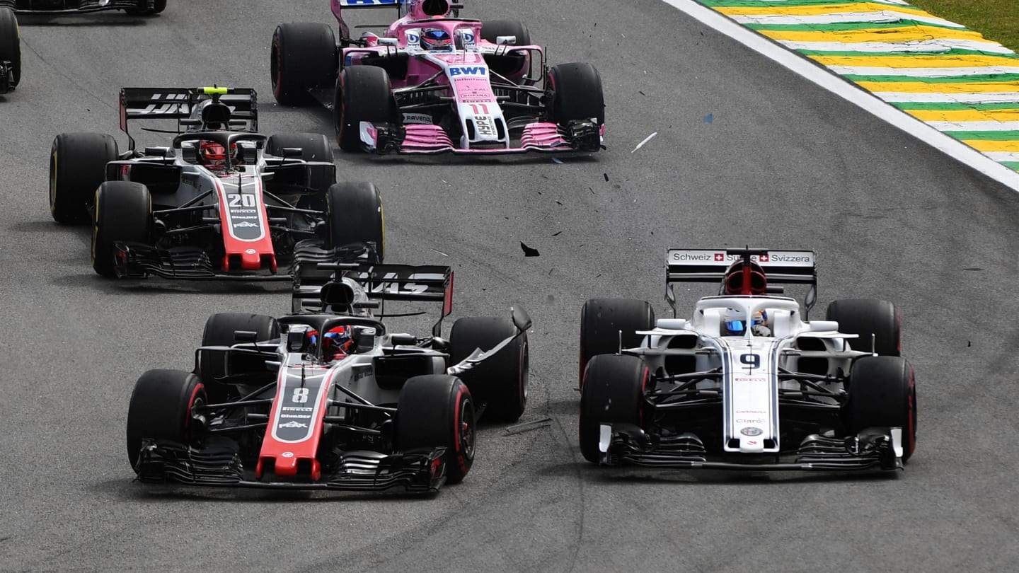 Marcus Ericsson, Alfa Romeo Sauber C37 and Romain Grosjean, Haas F1 Team VF-18 collide at the start of the race at Formula One World Championship, Rd20, Brazilian Grand Prix, Race, Interlagos, Sao Paulo, Brazil, Sunday 11 November 2018.