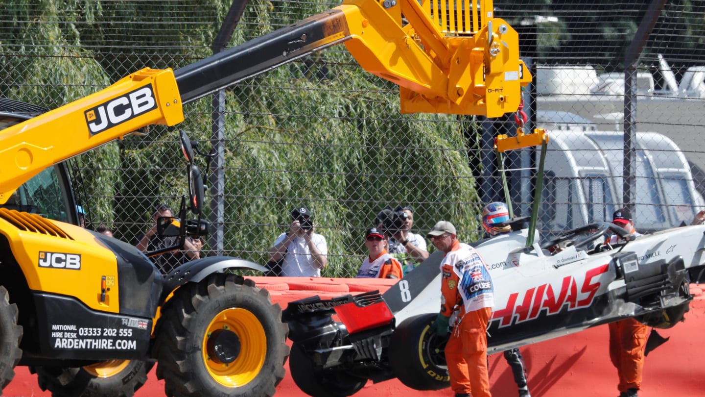 The car of Romain Grosjean (FRA) Haas VF-18 is recovered at Formula One World Championship, Rd10,