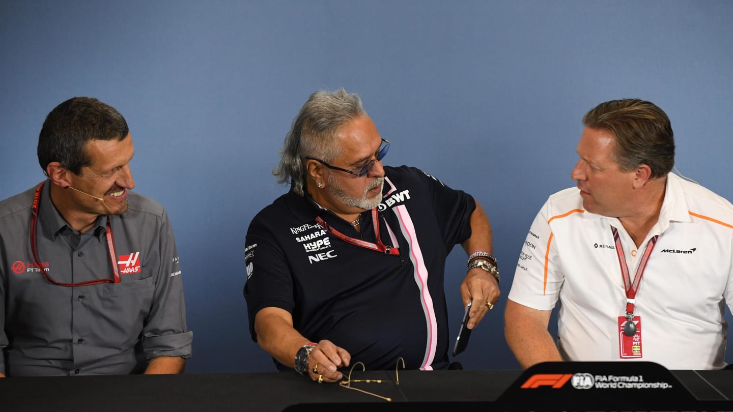 Guenther Steiner (ITA) Team Prinicipal, Haas F1 Team, Dr. Vijay Mallya (IND) Force India Formula One Team Owner and Zak Brown (USA) McLaren Racing CEO in the Press Conference at Formula One World Championship, Rd10, British Grand Prix, Practice, Silverstone, England, Friday 6 July 2018. © Simon Galloway/Sutton Images