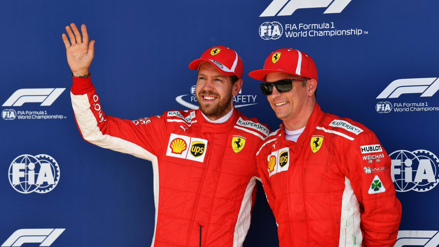 Sebastian Vettel (GER) Ferrari and Kimi Raikkonen (FIN) Ferrari celebrate in parc ferme at Formula