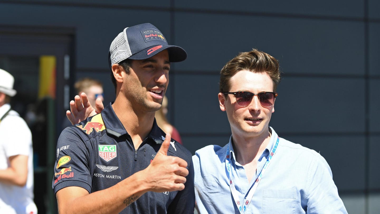 Daniel Ricciardo (AUS) Red Bull Racing with fan at Formula One World Championship, Rd10, British Grand Prix, Race, Silverstone, England, Sunday 8 July 2018. © Simon Galloway/Sutton Images