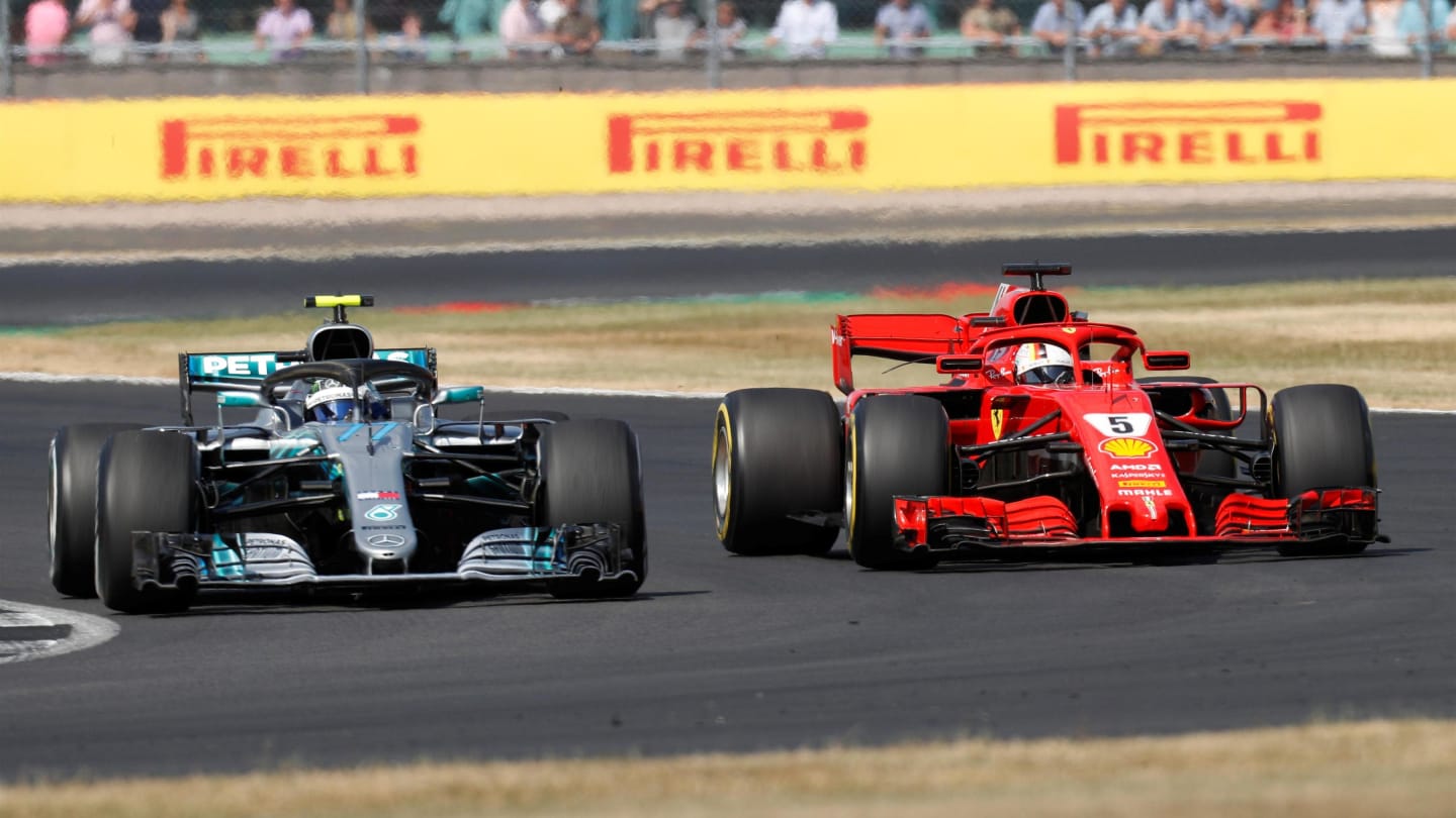 Valtteri Bottas (FIN) Mercedes-AMG F1 W09 EQ Power+ and Sebastian Vettel (GER) Ferrari SF-71H battle at Formula One World Championship, Rd10, British Grand Prix, Race, Silverstone, England, Sunday 8 July 2018. © Zak Mauger/LAT/Sutton Images