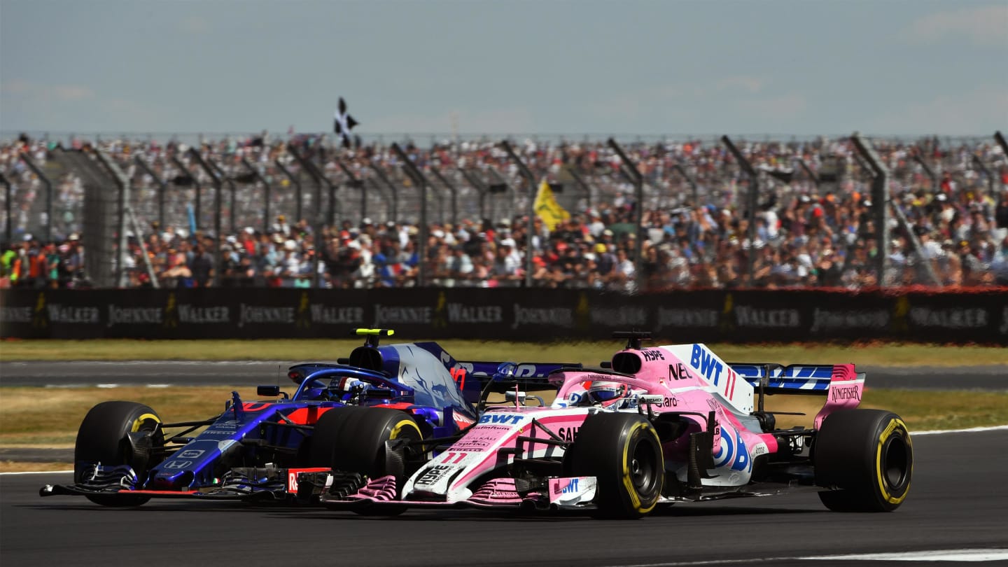 Pierre Gasly (FRA) Scuderia Toro Rosso STR13 and Sergio Perez (MEX) Force India VJM11 battle at Formula One World Championship, Rd10, British Grand Prix, Race, Silverstone, England, Sunday 8 July 2018. © Mark Sutton/Sutton Images