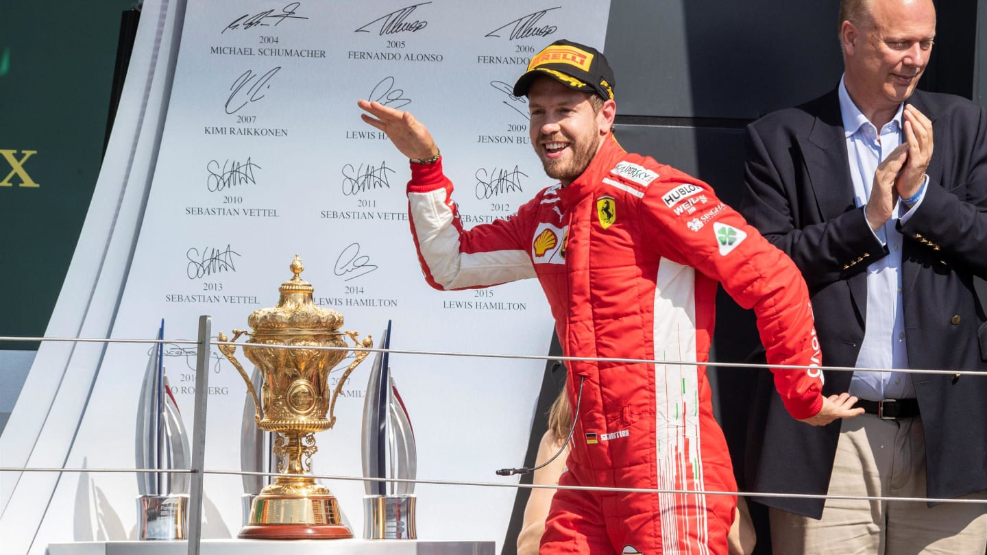 Race winner Sebastian Vettel (GER) Ferrari celebrates on the podium at Formula One World