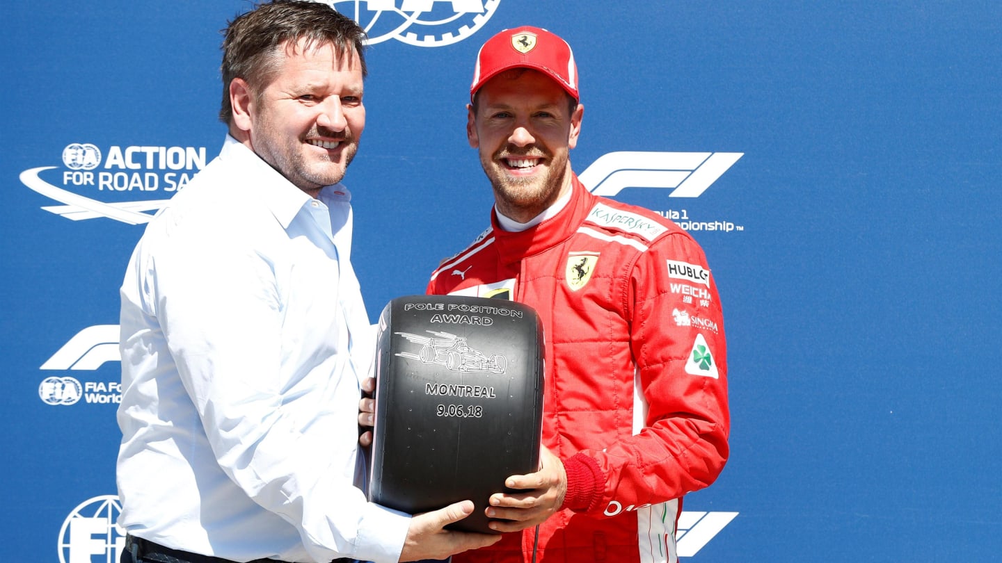 Vettel (GER) Ferrari receives the Pirelli Pole Position award from Paul Hembery (GBR) Pirelli Motorsport Director at Formula One World Championship, Rd7, Canadian Grand Prix, Qualifying, Montreal, Canada, Saturday 9 June 2018. © Glenn Dunbar/Sutton Images