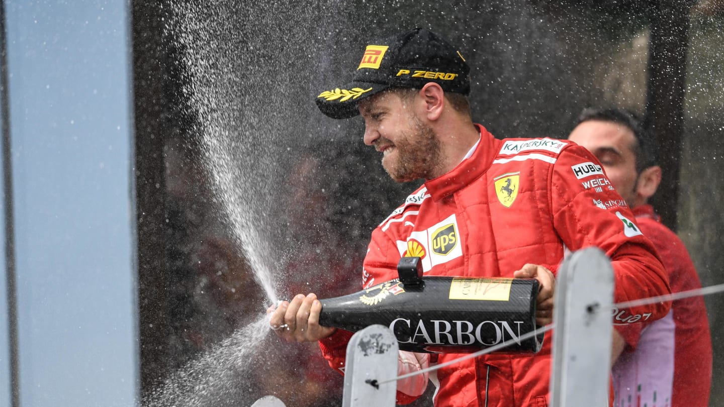 Sebastian Vettel (GER) Ferrari celebrates on the podium with the champagne at Formula One World Championship, Rd7, Canadian Grand Prix, Race, Montreal, Canada, Sunday10 June 2018. © Simon Galloway/Sutton Images