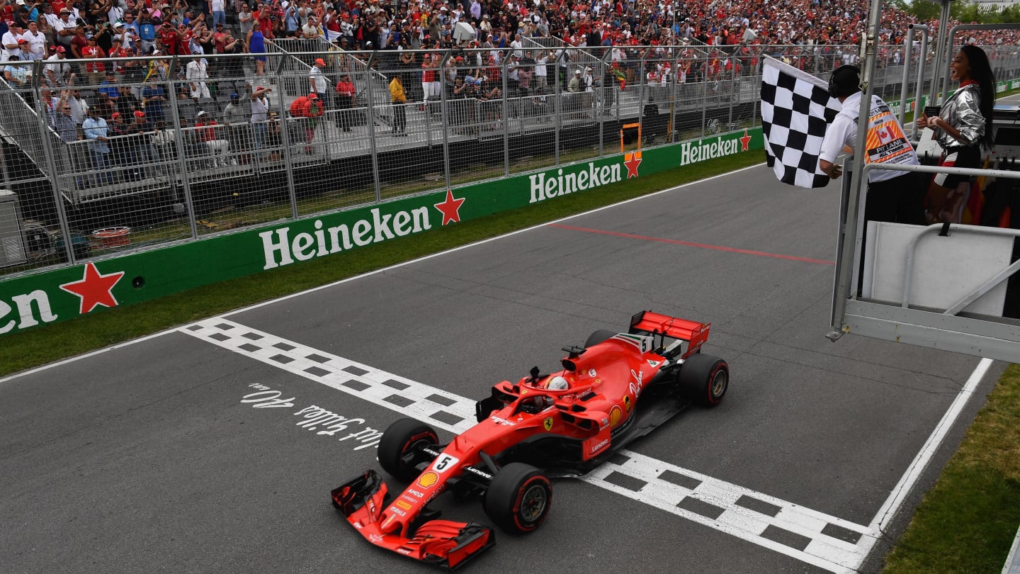 Race winner Sebastian Vettel (GER) Ferrari SF-71H takes the chequered flag at Formula One World