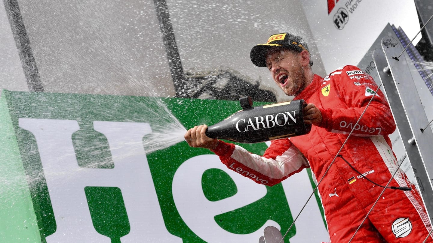 Race winner Sebastian Vettel (GER) Ferrari celebrates with the champagne on the podium at Formula One World Championship, Rd7, Canadian Grand Prix, Race, Montreal, Canada, Sunday10 June 2018. © Jerry Andre/Sutton Images