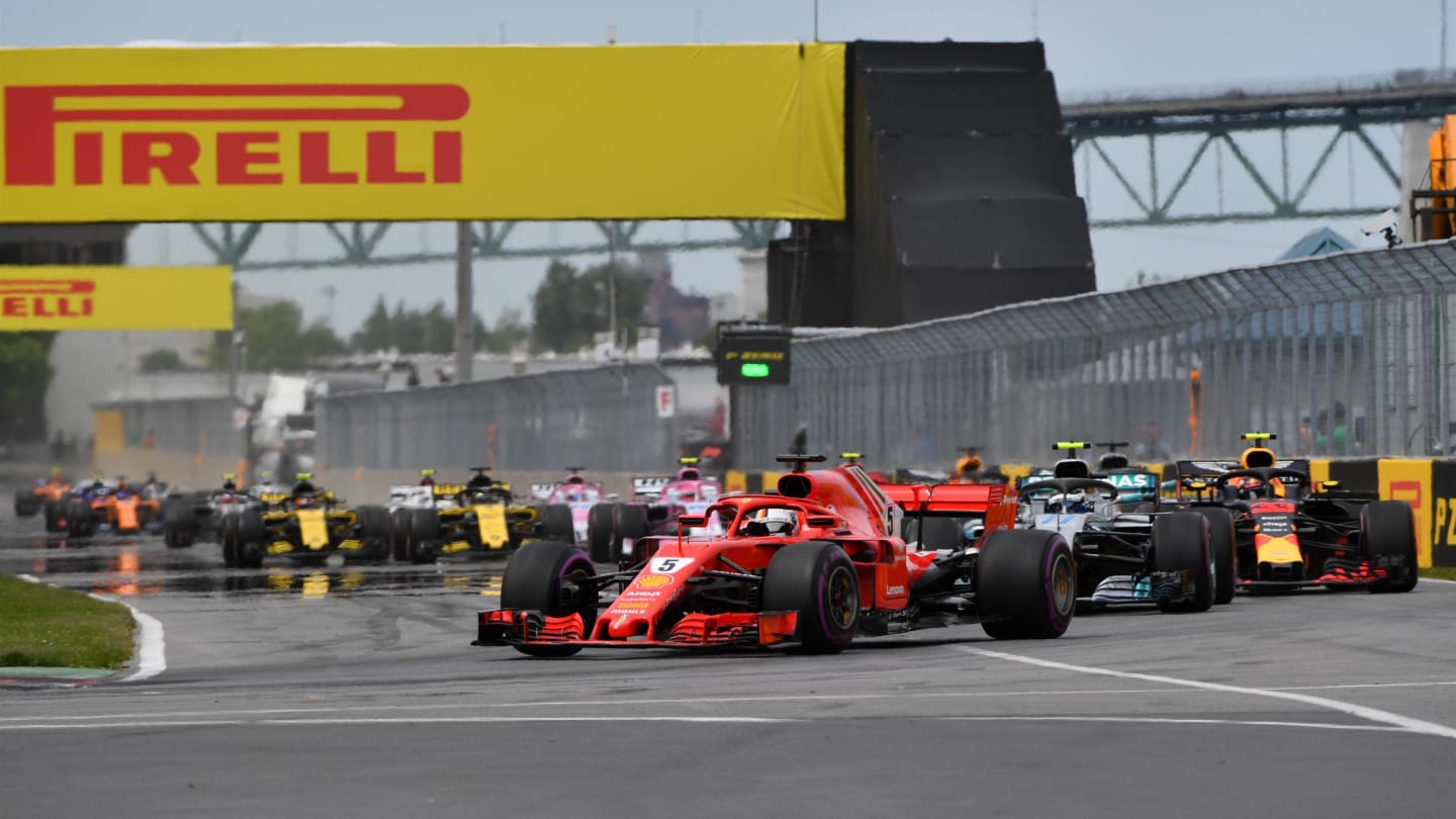 Sebastian Vettel (GER) leads Valtteri Bottas (FIN) Mercedes-AMG F1 W09 EQ Power+ at the start of the race at Formula One World Championship, Rd7, Canadian Grand Prix, Race, Montreal, Canada, Sunday10 June 2018. © Mark Sutton/Sutton Images