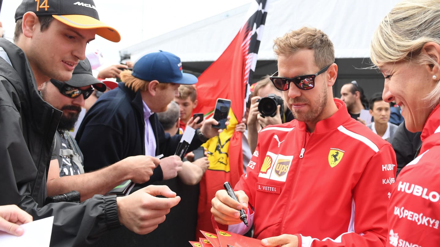 Sebastian Vettel (GER) Ferrari signs autographs for the fans at Formula One World Championship,
