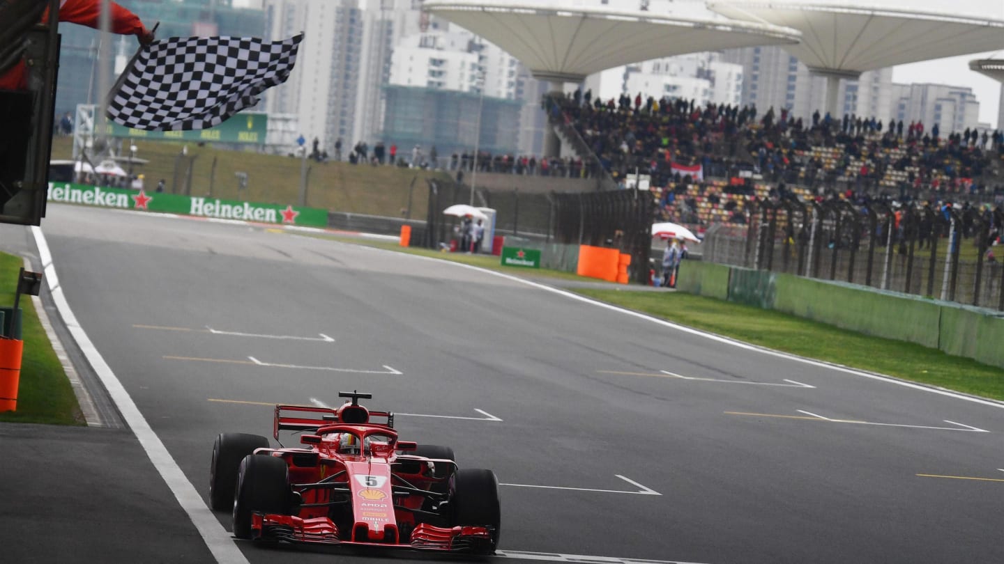 Pole sitter Sebastian Vettel (GER) Ferrari SF-71H takes the chequered flag at the end of Qualifying at Formula One World Championship, Rd3, Chinese Grand Prix, Qualifying, Shanghai, China, Saturday 14 April 2018. © Mark Sutton/Sutton Images