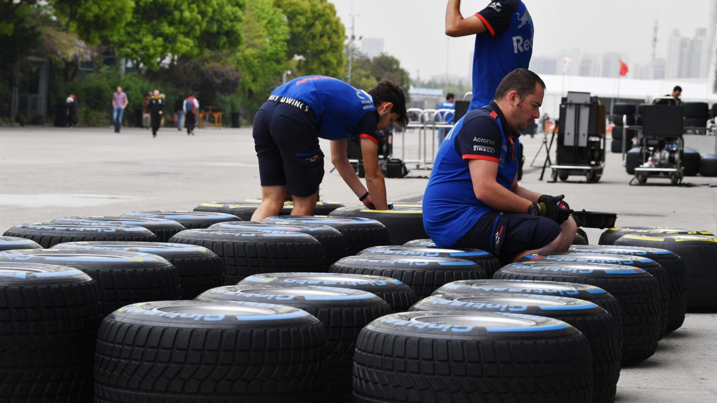 Scuderia Toro Rosso mechanics and Pirelli tyres at Formula One World Championship, Rd3, Chinese Grand Prix, Preparations, Shanghai, China, Thursday 12 April 2018. © Mark Sutton/Sutton Images
