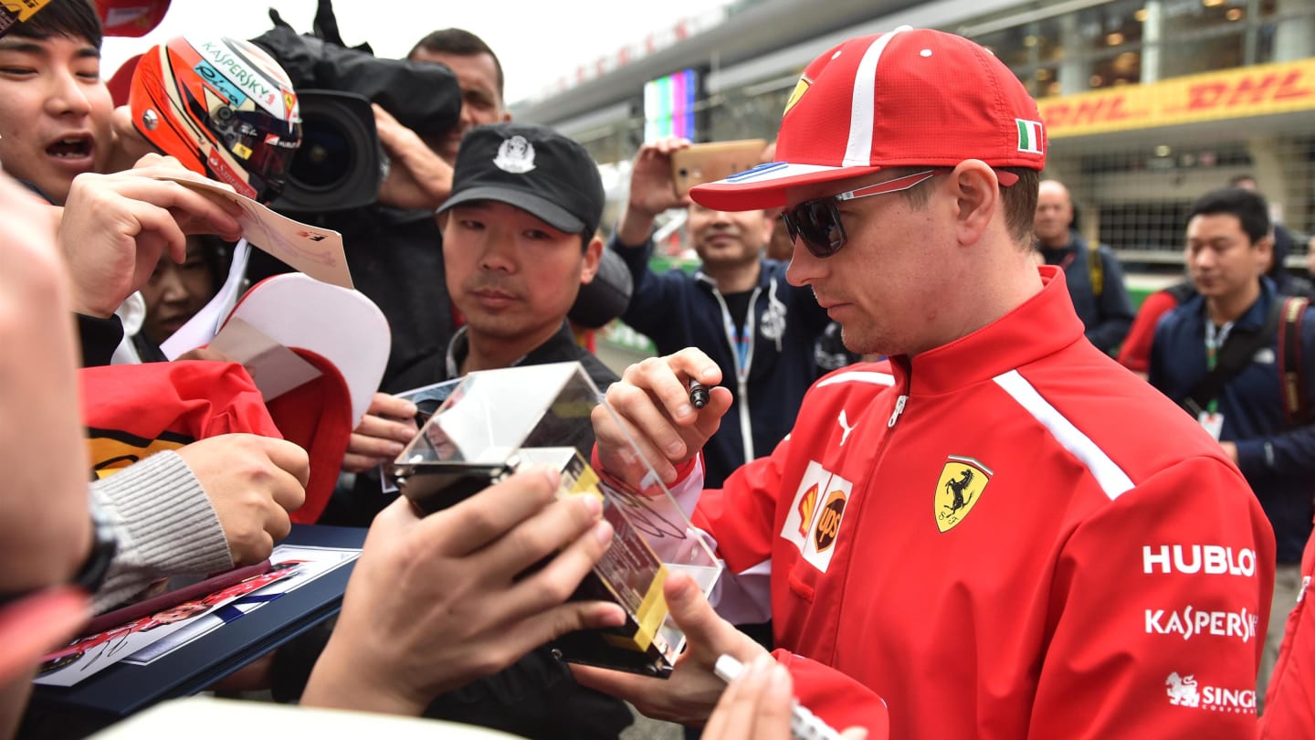 Kimi Raikkonen (FIN) Ferrari signs autographs for the fans at Formula One World Championship, Rd3, Chinese Grand Prix, Preparations, Shanghai, China, Thursday 12 April 2018. © Mark Sutton/Sutton Images