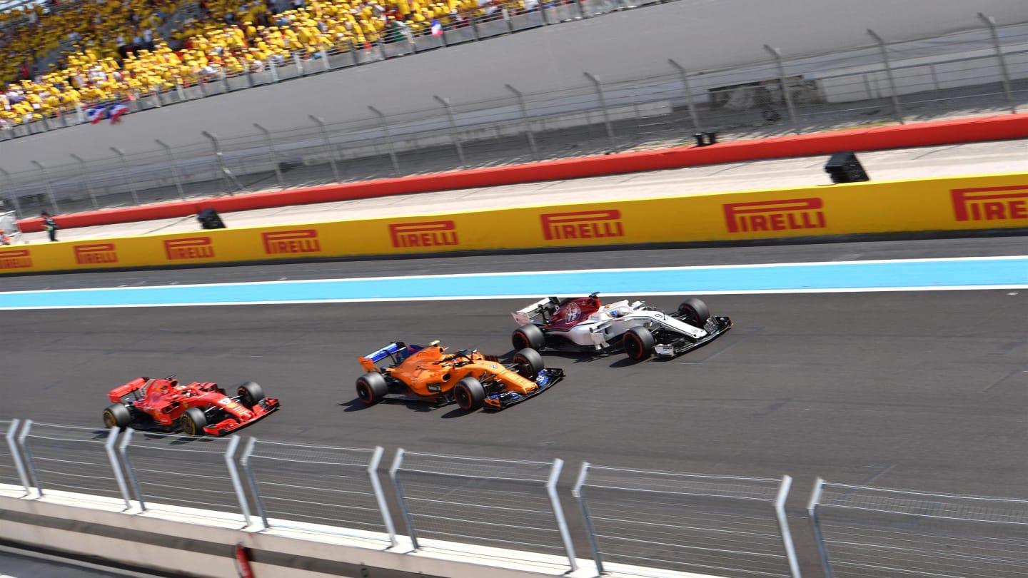 Sebastian Vettel (GER) Ferrari SF-71H, Stoffel Vandoorne (BEL) McLaren MCL33 and Marcus Ericsson (SWE) Alfa Romeo Sauber C37 battle at Formula One World Championship, Rd8, French Grand Prix, Race, Paul Ricard, France, Sunday 24 June 2018. © Jerry Andre/Sutton Images