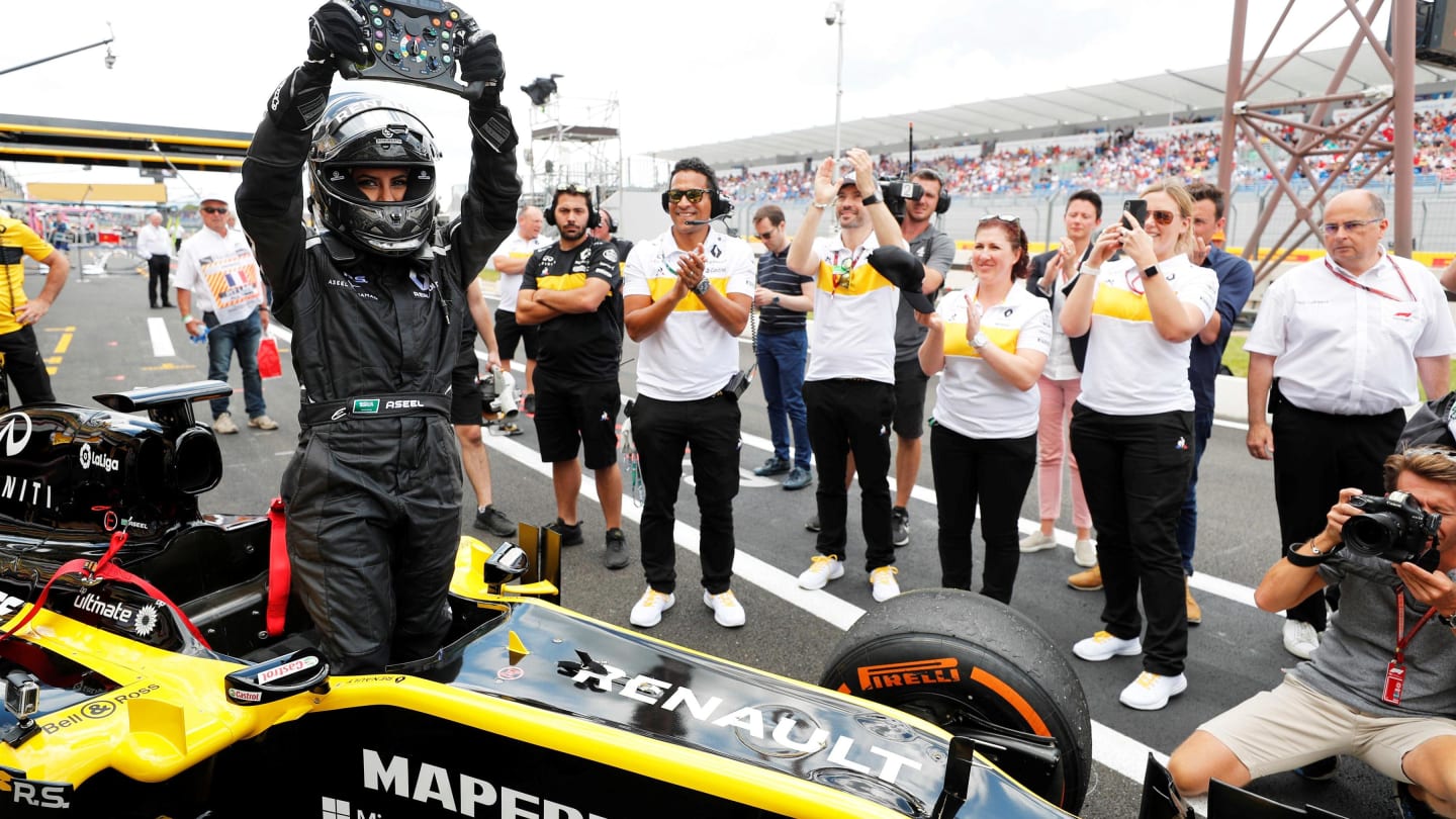 Aseel Al Hamad drives a Formula 1 car to mark the end of the ban for Women driving in Saudia Arabia